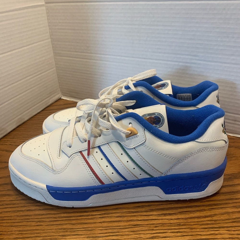 adidas White Sneakers with Blue Collar and Multicolor Crest Patch